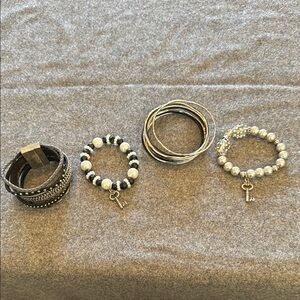 Set of silver four  and black bracelets for less than price of one!
